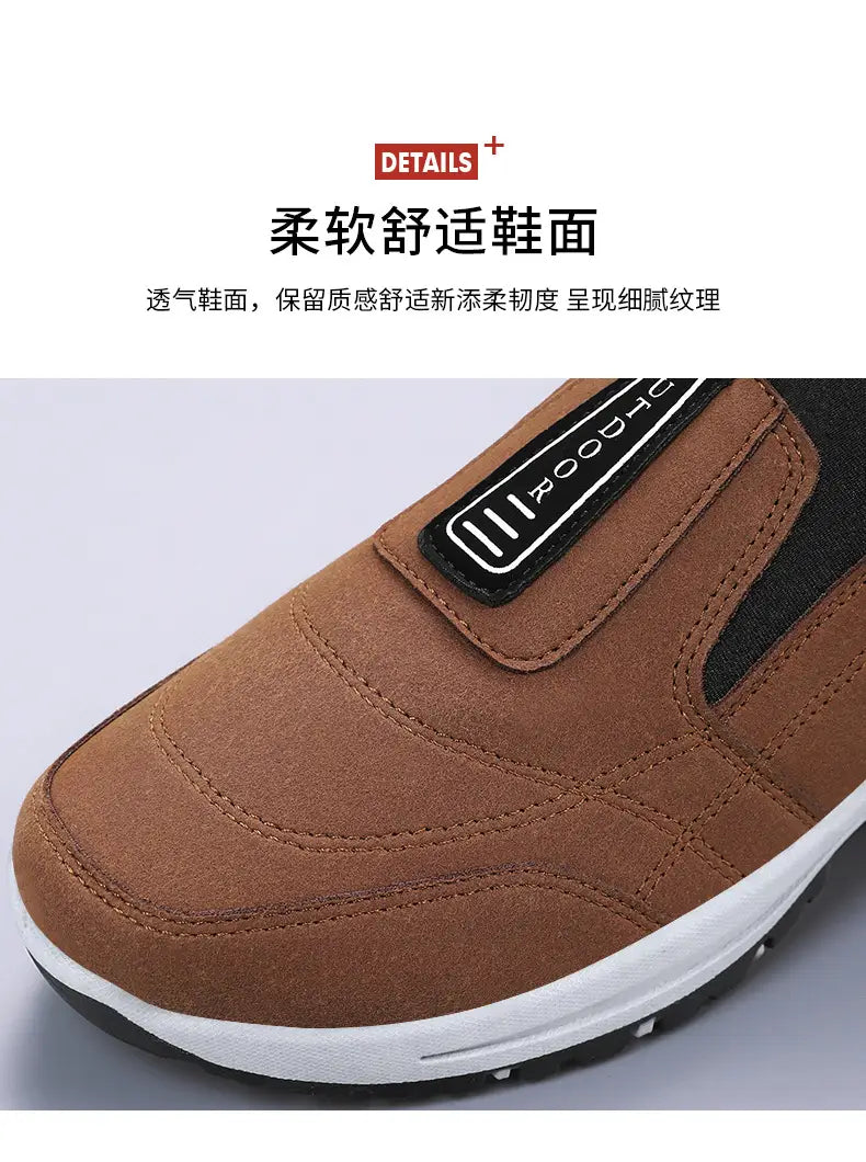 Men orthopedic slip-on walking shoe in brown suede-like material with a black strap featuring white lettering and detailed stitching.