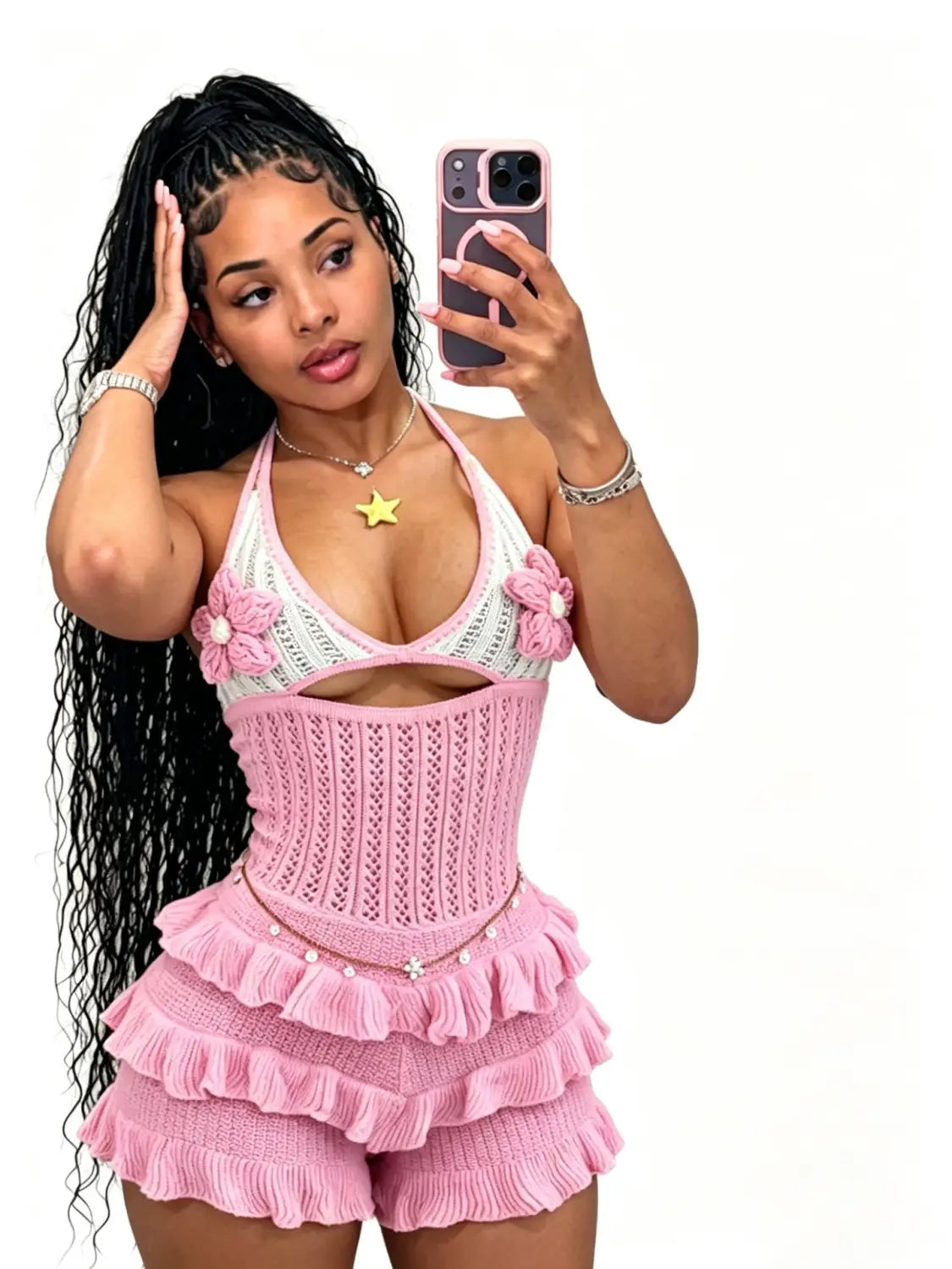 pink knitted romper with floral embellishments and ruffled shorts designed as a knitted ruffle halter romper summer playsuit