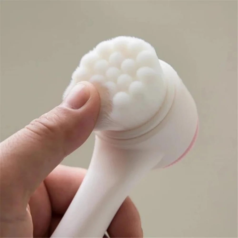 White silicone pet paw cleaner grooming brush with soft rounded fiber bristles and a sleek handle for gentle and effective cleaning.