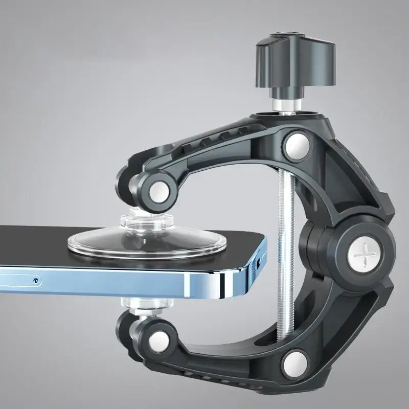 black adjustable phone clamp with transparent suction cup holding a blue smartphone as a phone screen separator tool with minimalist style