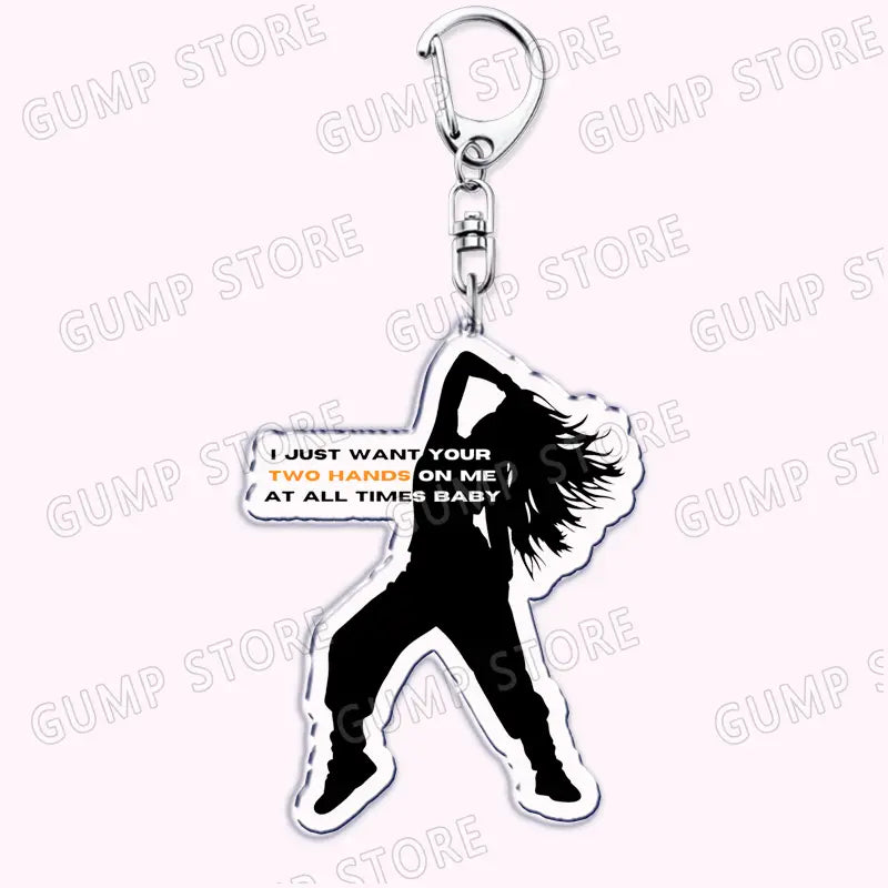 black silhouette acrylic keychain featuring a dancing figure with white and orange text i just want your two hands on me at all times baby for tate mcrae music fans