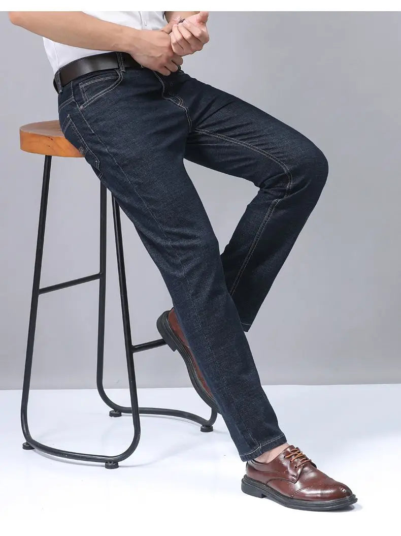 Men’s dark blue stretch cotton straight jeans with visible stitching and a classic fit for casual wear
