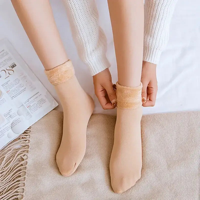Beige sheer tights with a soft fuzzy cuff made from cashmere wool designed as winter thermal socks for cold weather.
