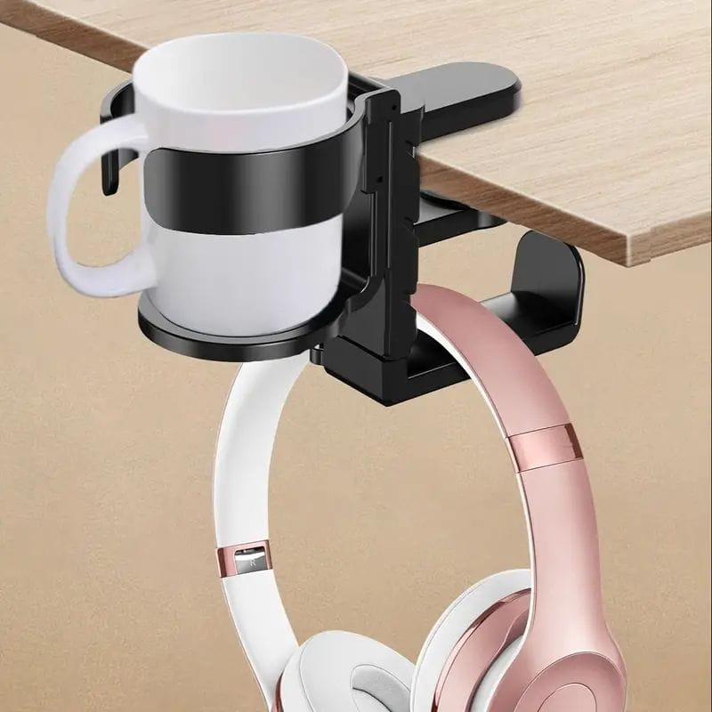 Black desk-mounted mug and headphone organizer made of metal holding a white ceramic mug for efficient desk cup holder and headphone hook use.