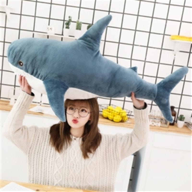 plush blue shark stuffed animal pillow made of soft fabric designed for comfort and play