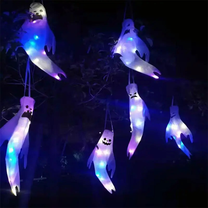 Illuminated halloween ghost led hanging windsock with glowing blue and purple lights for home outdoor decoration.