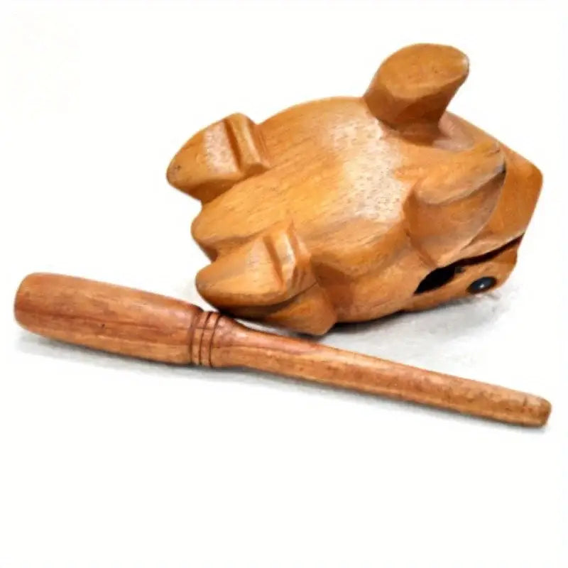 Hand carved wooden frog nutcracker made from rain wood featuring a frog body design with a matching wooden mallet.