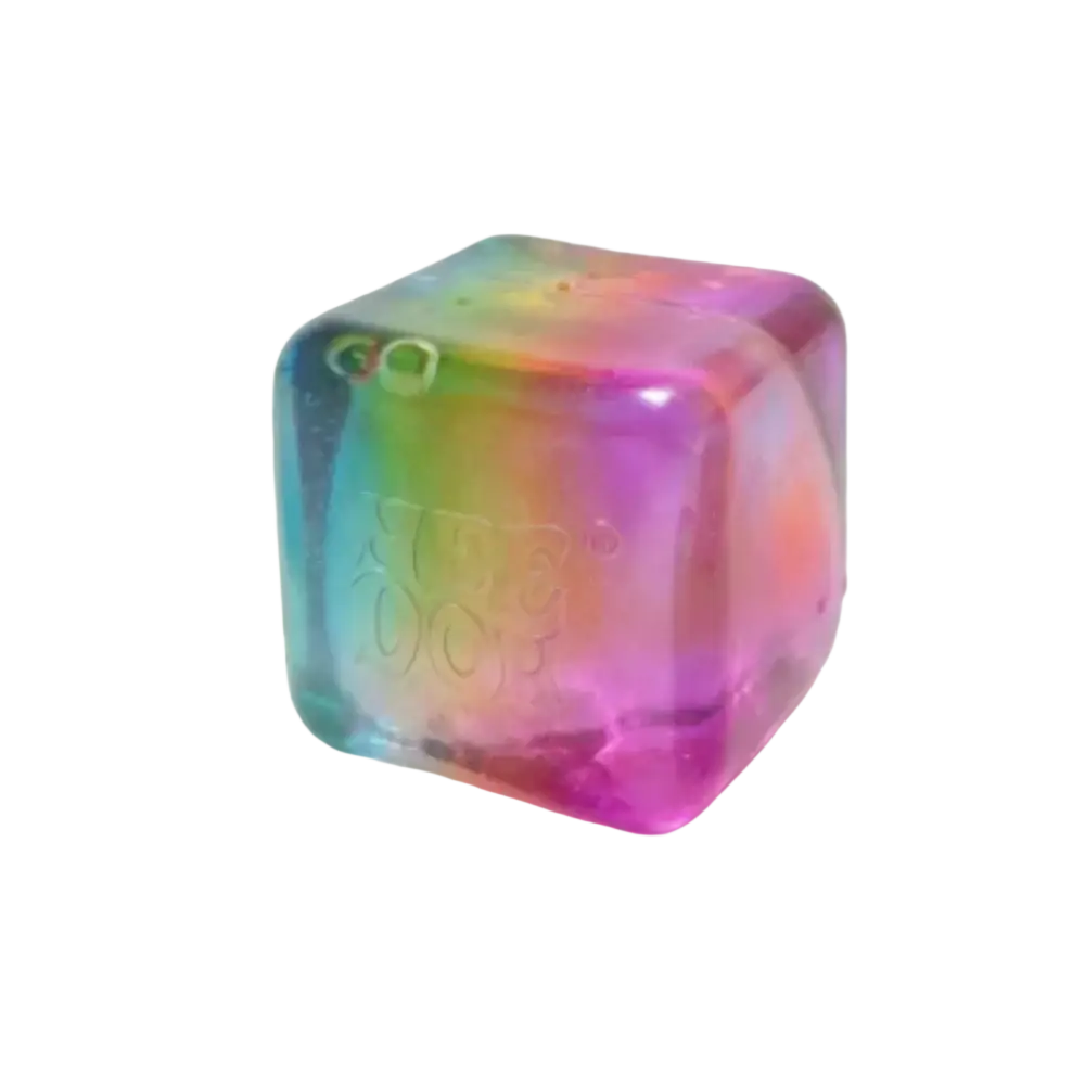 A translucent rainbow-colored cube-shaped NeeDoh squishy fidget toy with a glossy finish and embossed branding