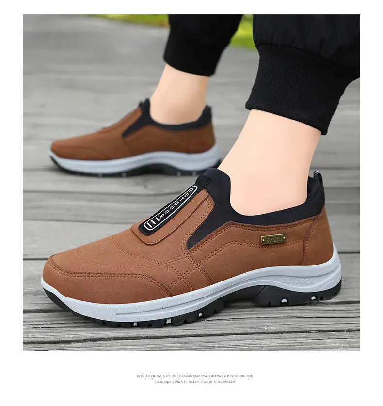 men orthopedic slip-on walking shoes in brown and black with a textured upper, white midsole, and rugged outsole designed for comfort and support