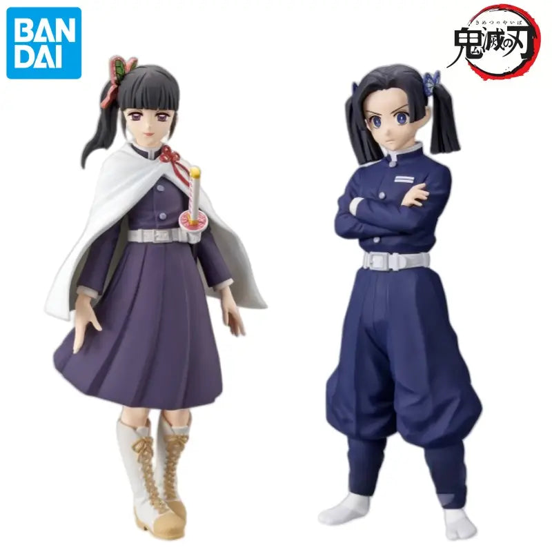 Dos figurines de anime de Demon Slayer en PVC, que presentan a Sabito Makomo Tsuyuri en un uniforme morado con capa blanca y a Makomo Tsuyuri Kanao en atuendo azul marino, en un set de figura de acción de 16 cm