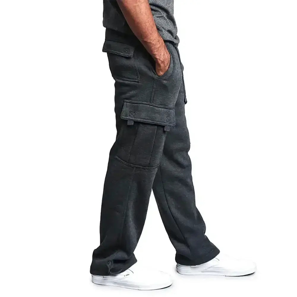 Pantalons cargo pour homme gris foncé, avec plusieurs poches et une coupe ample, conçus comme des pantalons de jogging confortables.