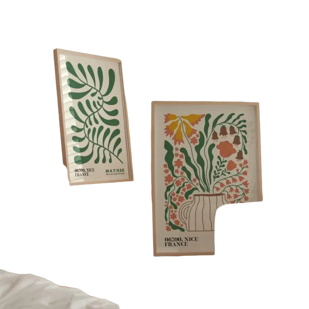 Two frameless matisse-style botanical prints featuring green leaf patterns and vibrant floral arrangements displayed front