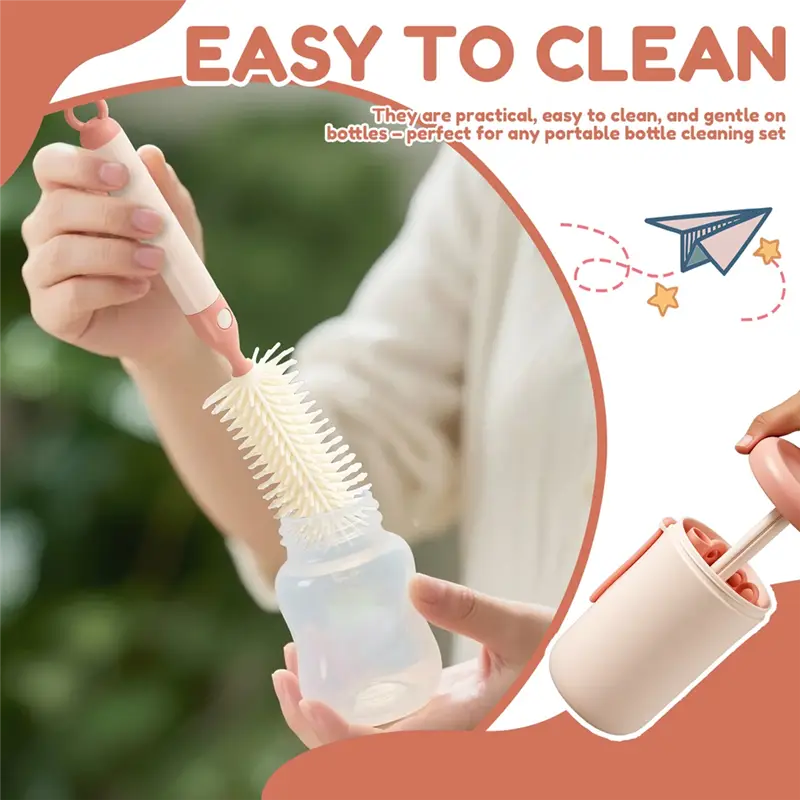 Pink and white silicone bottle brush with soft bristles designed for easy cleaning of baby bottles in the travel baby bottle cleaner brush set.
