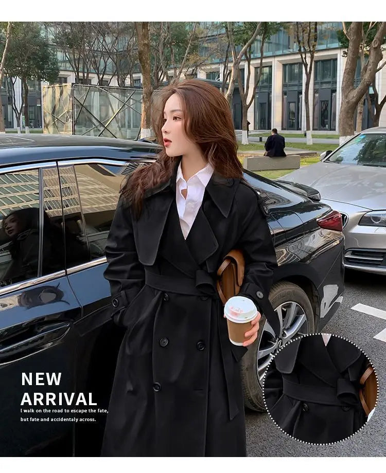 Black women double breasted trench coat featuring a belted waist and stylish front design.