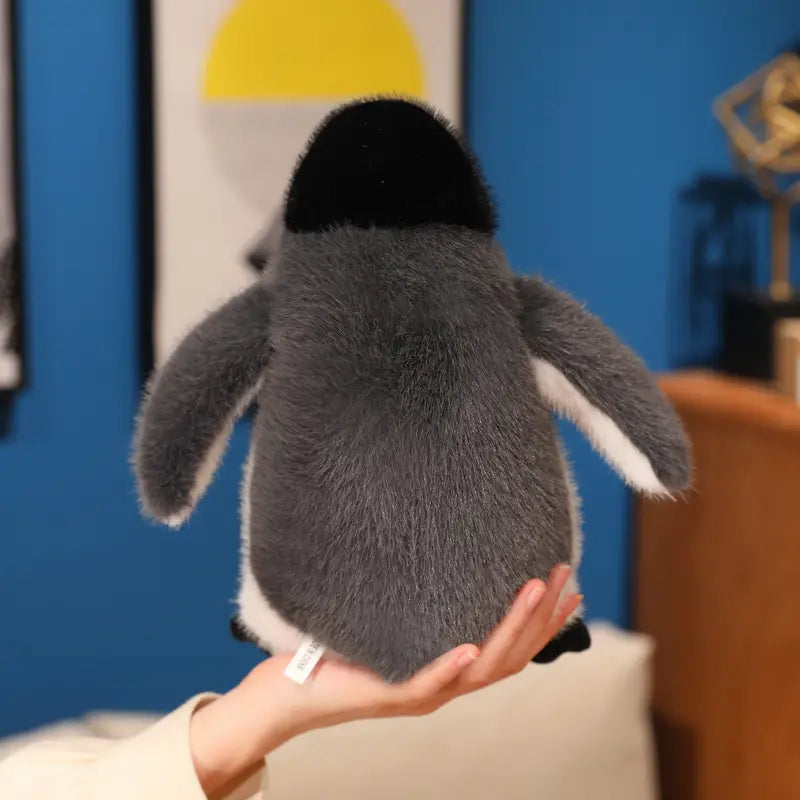 A plush penguin stuffed animal soft toy pair featuring a black head, gray body, and white accents on its wings and belly.