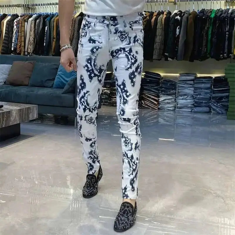 Men black floral slim fit white denim jeans featuring a bold black floral pattern with distressed details.