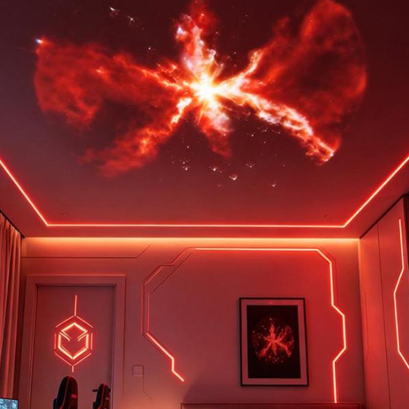 usb galaxy projector displaying a glowing red nebula projection with a radiant central starburst and swirling cosmic clouds using replaceable projection discs.