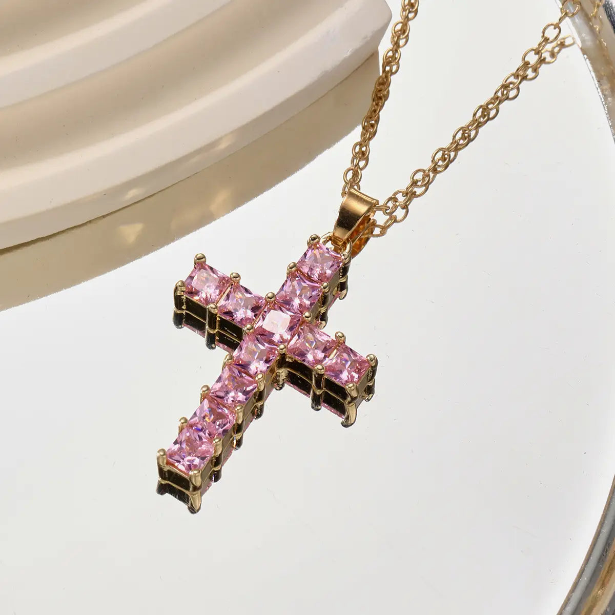 a gold-toned cross pendant adorned with sparkling pink square-cut stones designed as female pendants gold for fashion necklaces female.