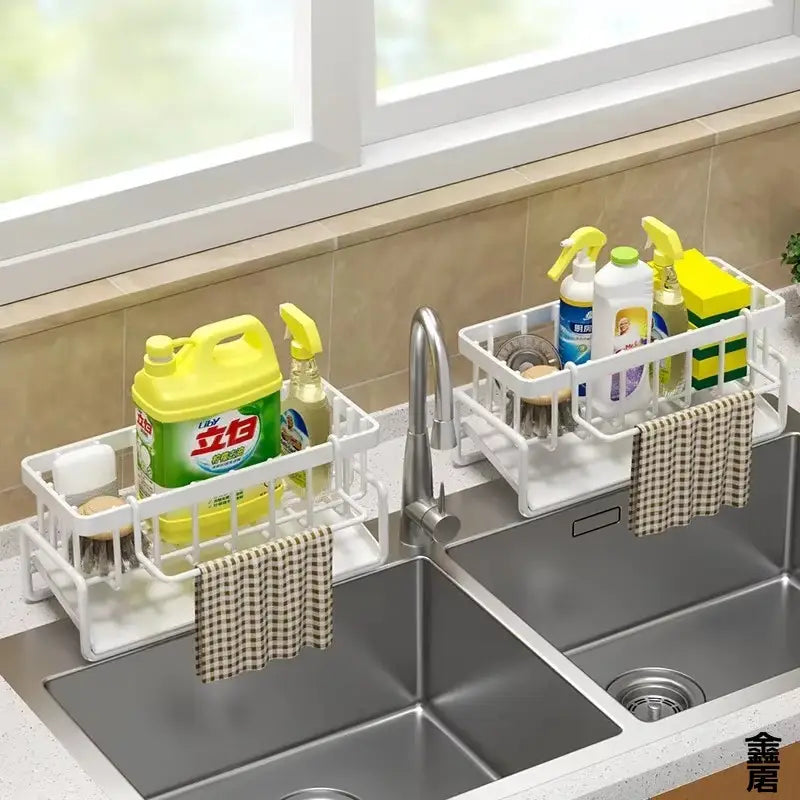 white plastic sink organizer with drainage rack featuring a grid design, holding cleaning supplies and two checkered towel holders for kitchen use
