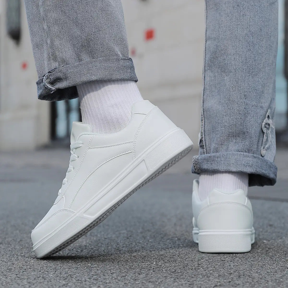Men white leather minimalist low top sneakers featuring a clean design and smooth leather upper.