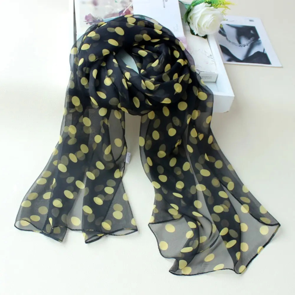 Black sheer silk head wrap scarf with yellow polka dots designed as a polka dot silk head wrap scarf.