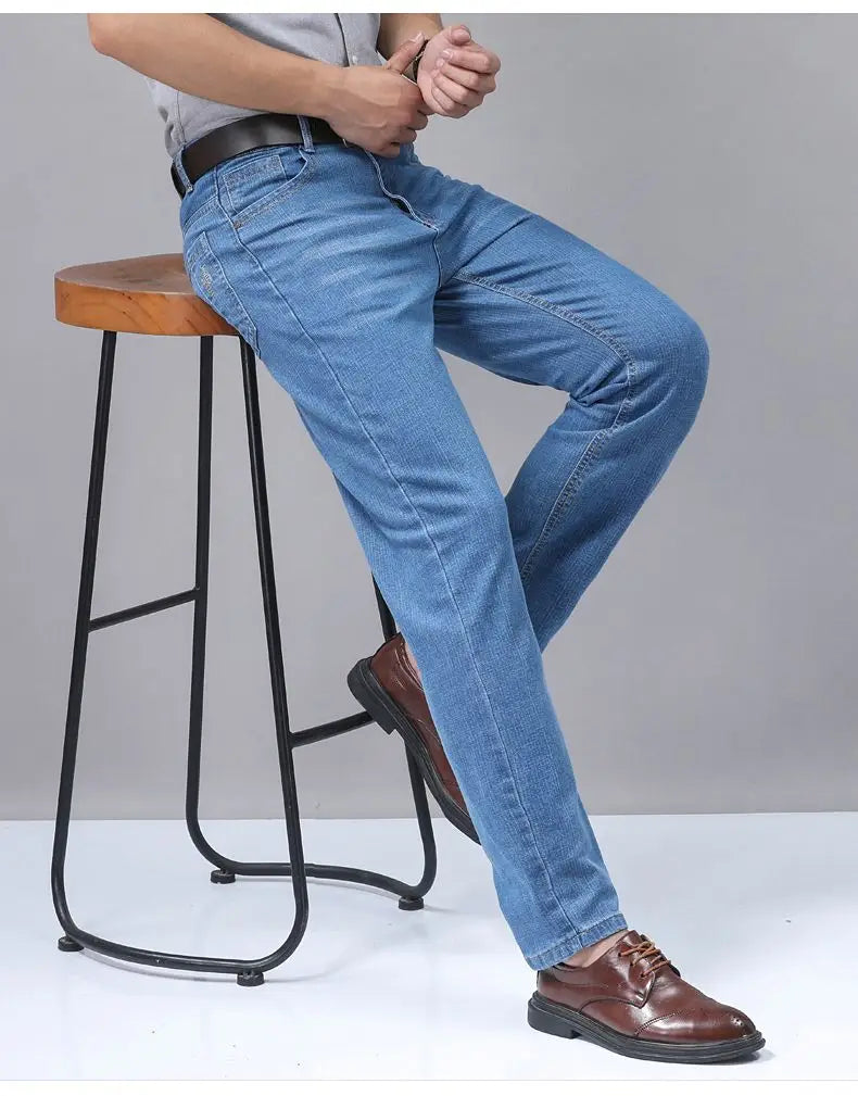 Men’s stretch cotton straight jeans casual trousers in light-wash blue denim with a classic straight-leg cut and visible stitching details.