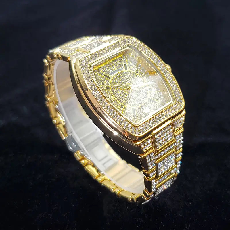 Gold iced out square diamond mens watch in gold tone with a crystal-encrusted bezel and intricate diamond-encrusted dial luxury quartz timepiece.