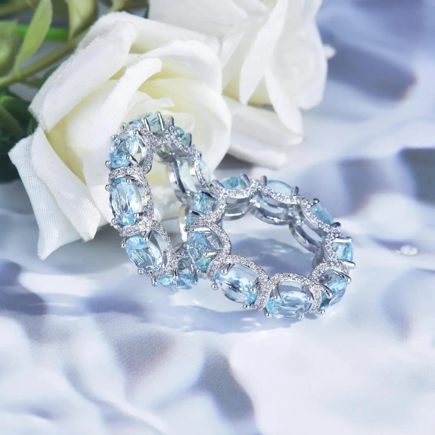 Elegant silver-toned bracelet featuring oval-cut sky blue gemstones accented with sparkling diamonds from the Aquamarine Crystal Bridal Jewelry Set.
