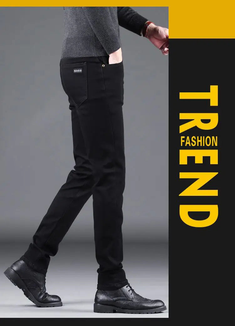 men black slim fit stretch denim jeans showing the back side with subtle texture and a small brand patch on the back pocket