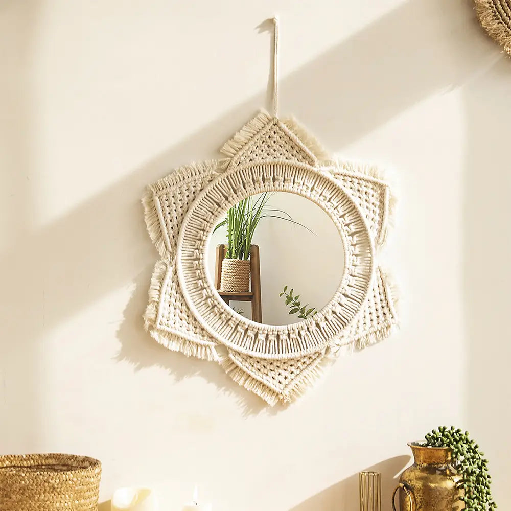 cream-colored macrame wall mirror with star-shaped fringe and tassels designed for living room home decor