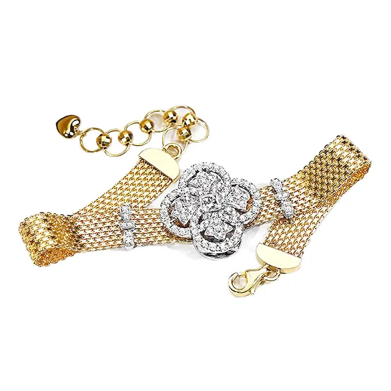 Crystal flower gold mesh cuff bracelet with a central silver toned floral cluster adorned with sparkling stones and diamond like embellishments on the clasp.