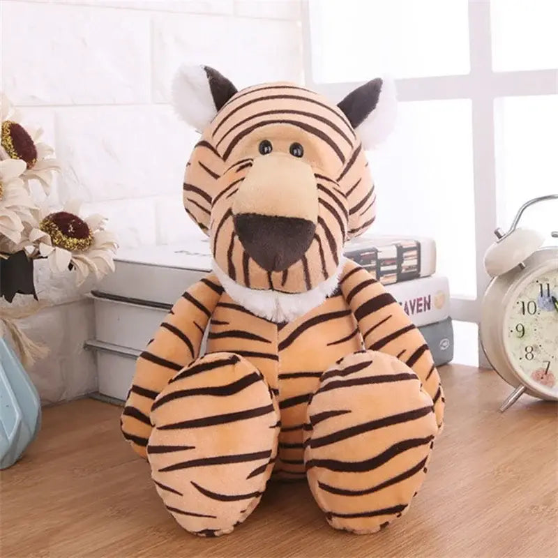 orange and black striped plush tiger toy with white inner ears and a fluffy white collar featured in the lion elephant tiger stuffed animal toy collection