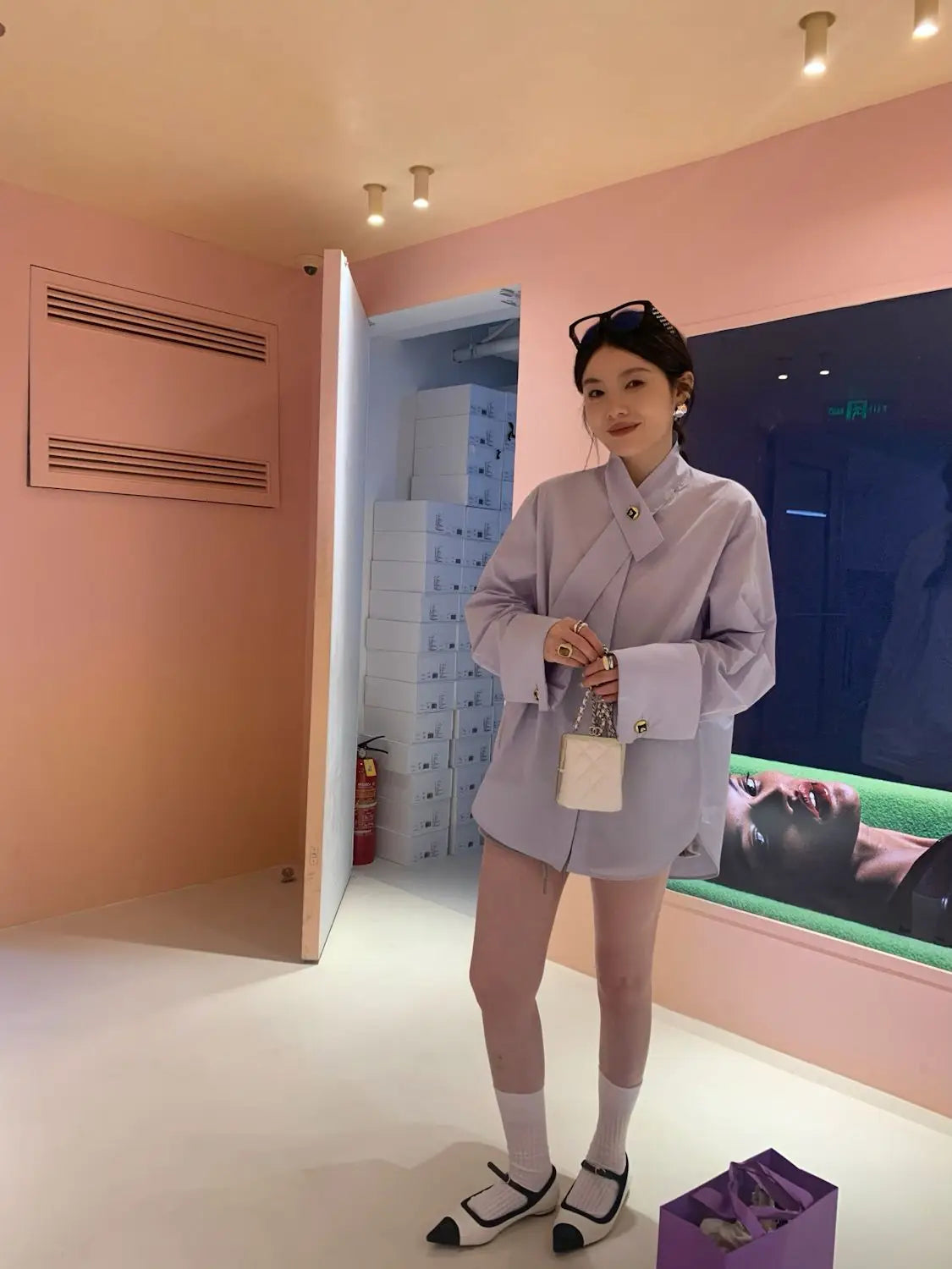 lavender oversized blouse with wide sleeves and a front tie detail shown from the front, combining flowy fabric and elegant style for casual or semi-formal wear