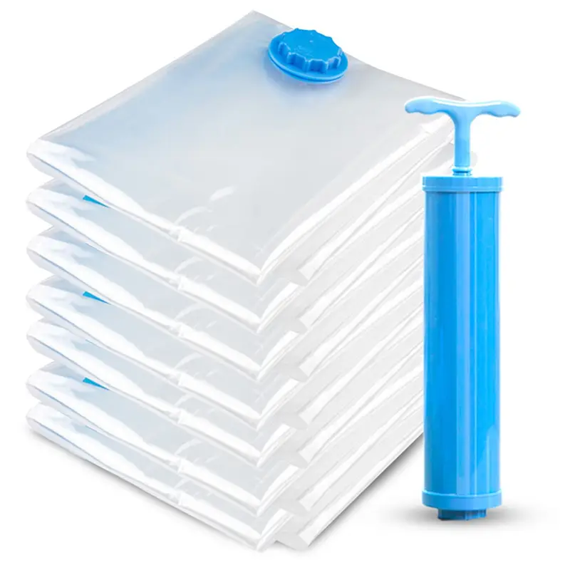 Set of clear plastic vacuum storage bags with blue caps and a matching blue hand pump for space saving clothes.