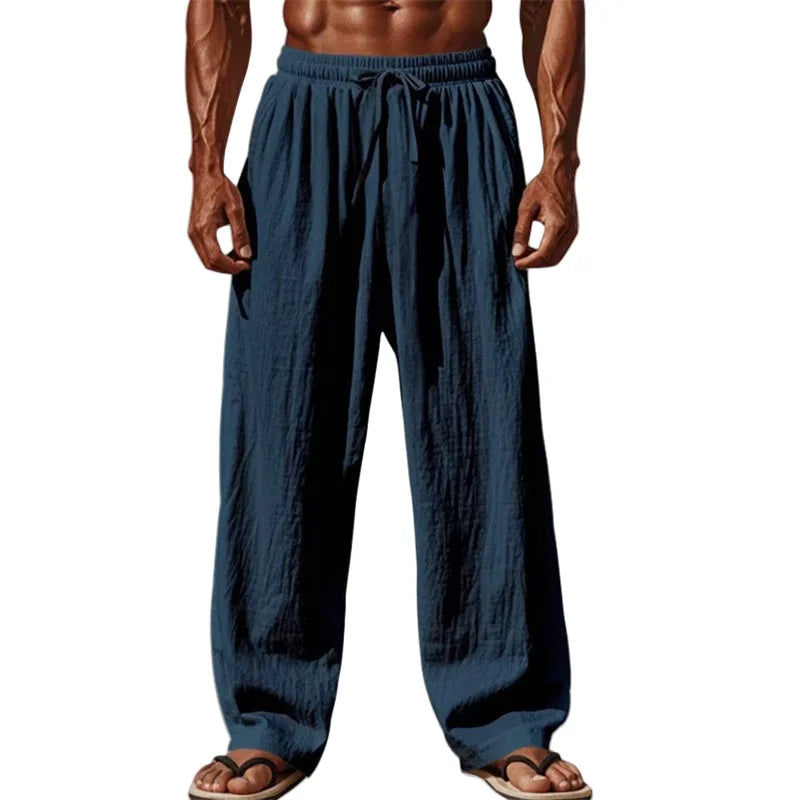 Dark blue men cotton linen casual pants with loose straight leg design and elastic waistband with drawstring.