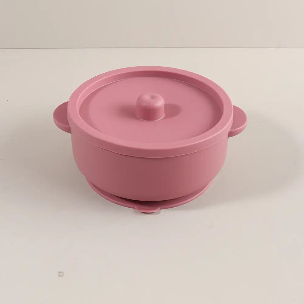 Rosa Silikon-Baby-Fütter-Schüssel mit Saugfuß und Seitengriffen, konzipiert für die Verwendung als Schüssel zum Zufüttern in Silikon/Edelstahl.