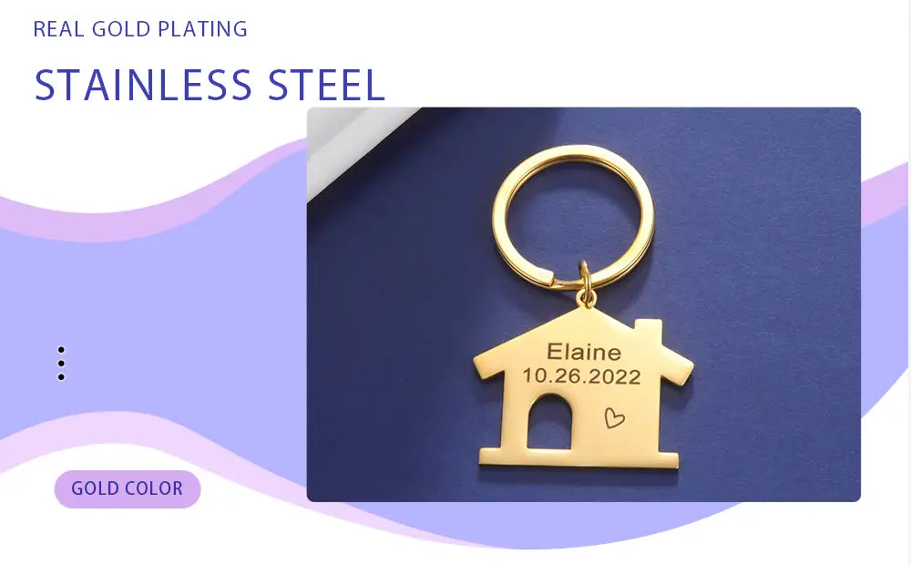 Gold-colored house-shaped keychain made of metal with engraved name and date for personalized couple gift