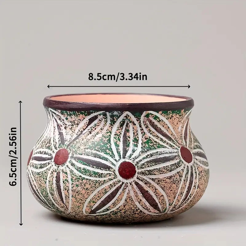 Hand-painted ceramic succulent planter pot with an earthy-toned textured surface featuring white outlined floral patterns with red centers and no visible packaging damage.