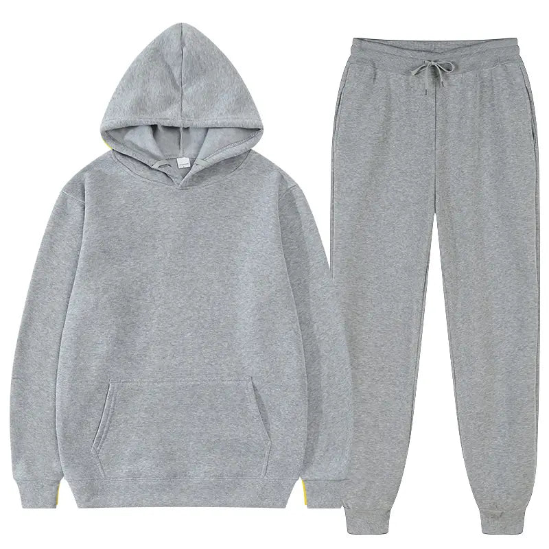 Ensemble décontracté sweat à capuche et jogging en molleton gris chiné pour homme, avec capuche à cordon de serrage et poche avant, accompagné de joggers assortis.