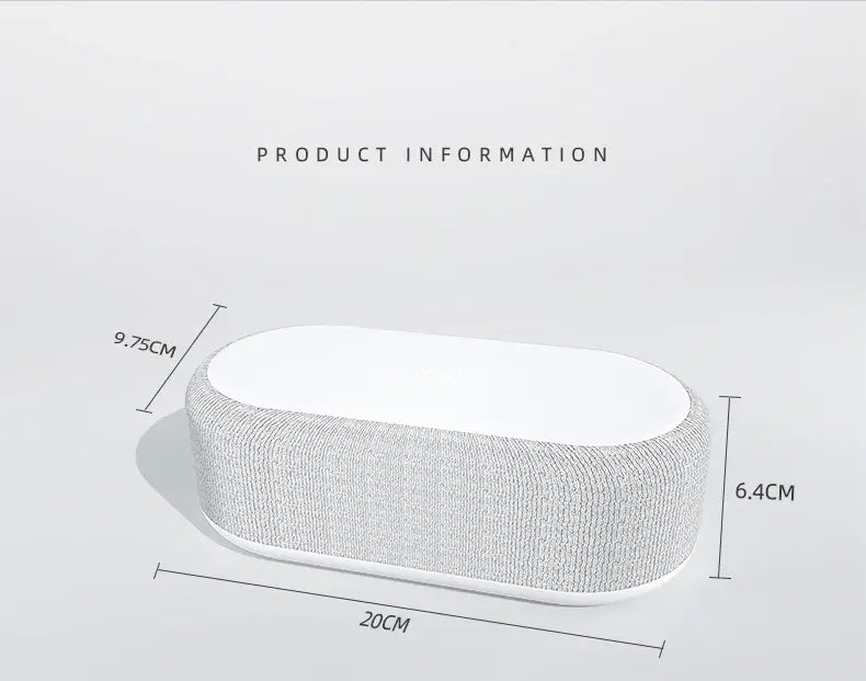 Un élégant haut-parleur Bluetooth en tissu gris avec fonction de charge sans fil et mode d’économie d’énergie : il présente un extérieur ovale texturé et une surface supérieure blanche lisse.