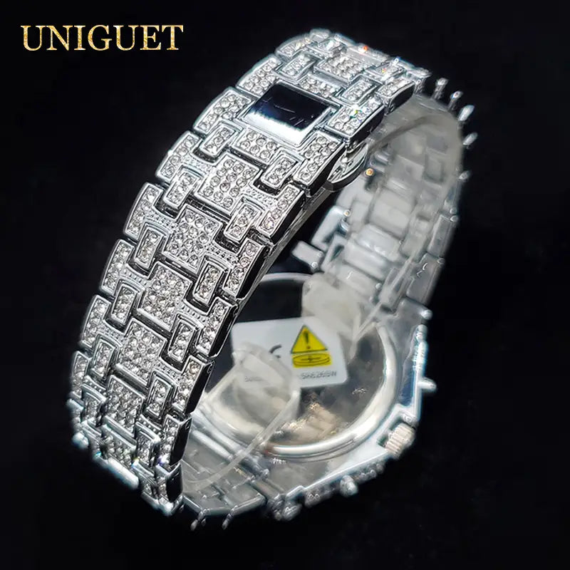 Silver-toned luxury iced diamond men’s quartz watch with a pave-set diamond-encrusted bracelet and a sleek black face designed as a hip hop timepiece.