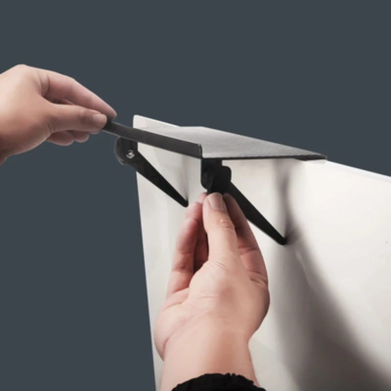 black metal wall-mounted shelf bracket with adjustable arms designed for an adjustable screen top storage shelf monitor stand