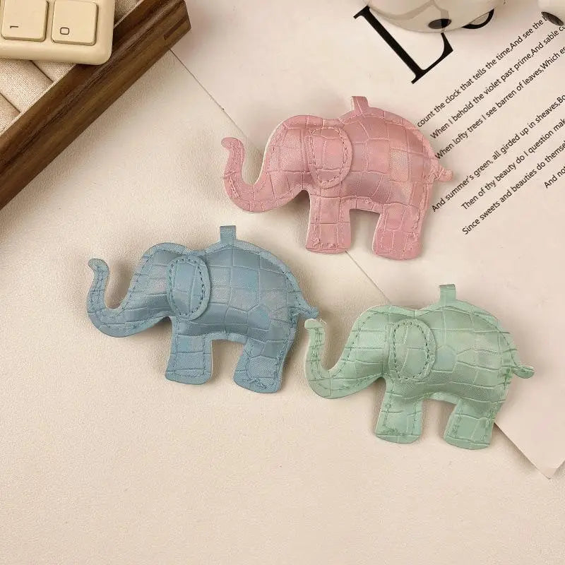 Three pastel-colored pu leather elephant-shaped keychains with crocodile skin texture and stitched details for diy animal charm use.