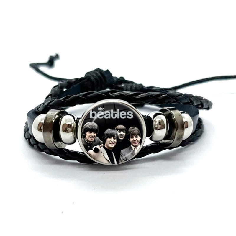 Black braided leather bracelet with silver-toned metal beads and a circular charm featuring the Beatles photo under a glass dome.