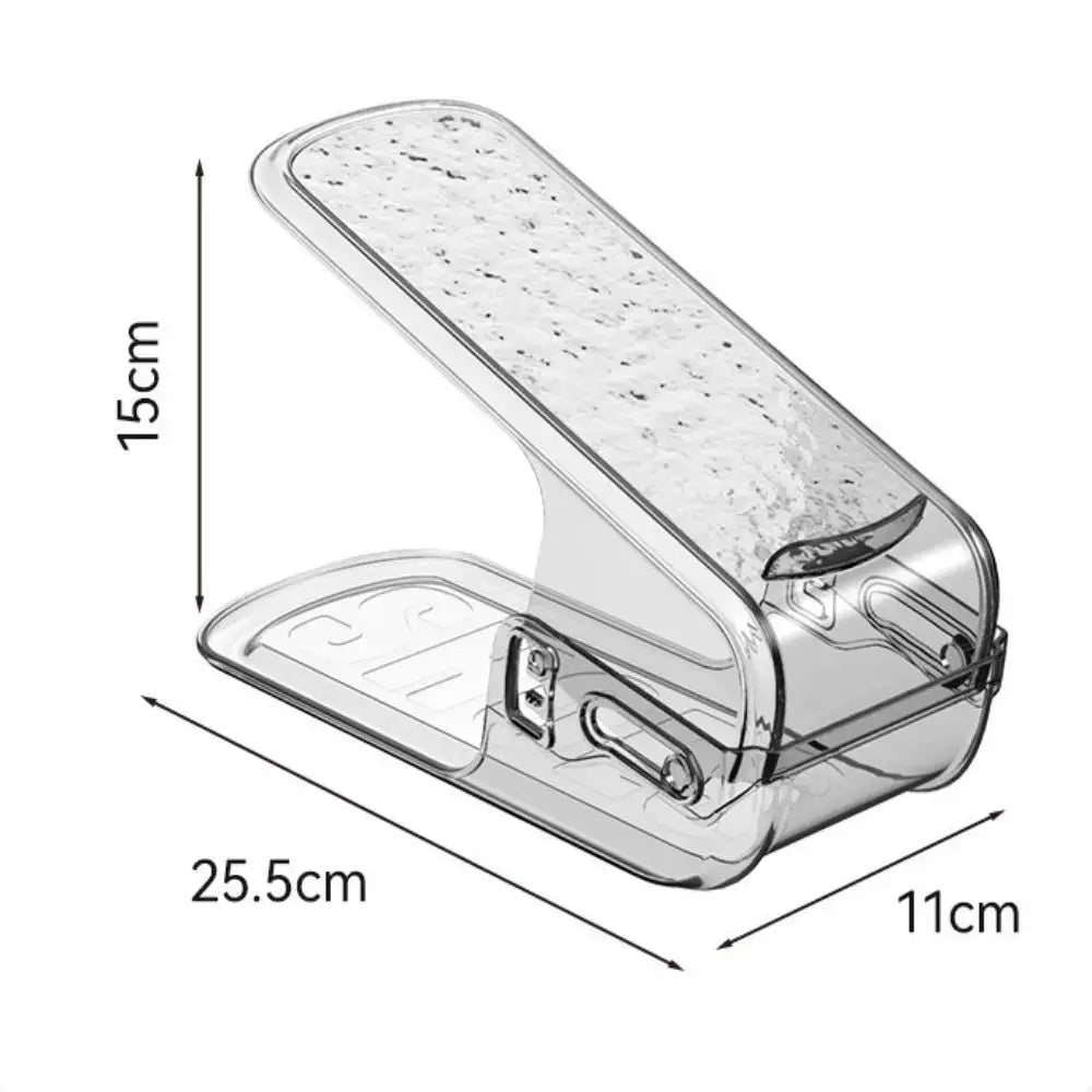 Clear plastic shoe slots organizer with textured top surface and clip mechanism designed as a double layer shoe rack for efficient footwear storage.