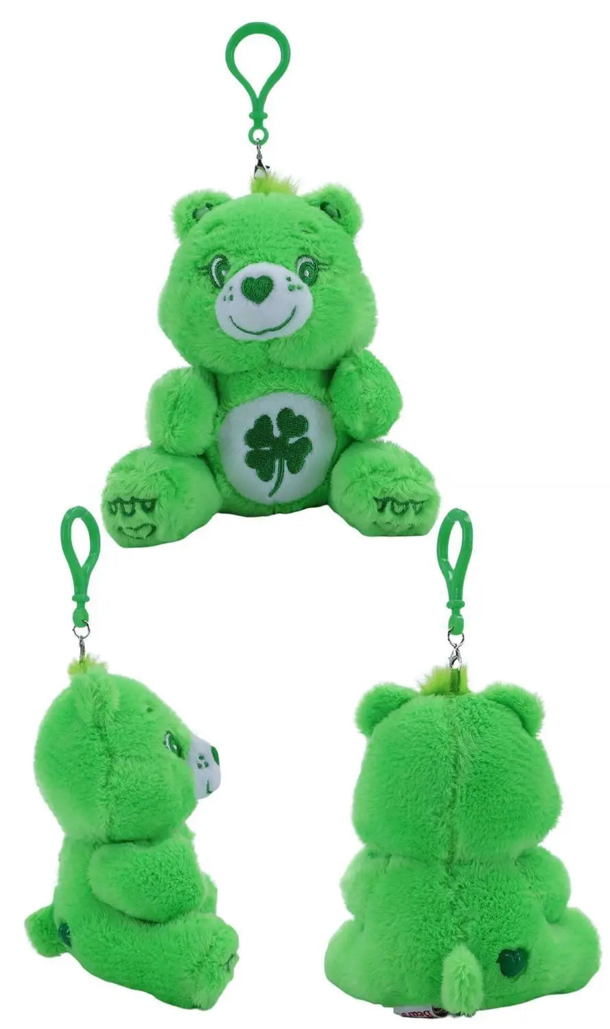 green plush care bears plush bag pendant keychain toy featuring a white four-leaf clover on its belly, green eyes, and a clip for attaching to bags or keys.