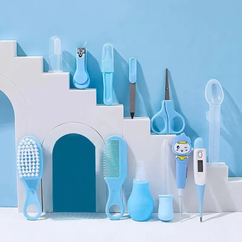 blue plastic baby healthcare grooming kit 12 piece set featuring a thermometer with a cartoon character for infant care and health monitoring.