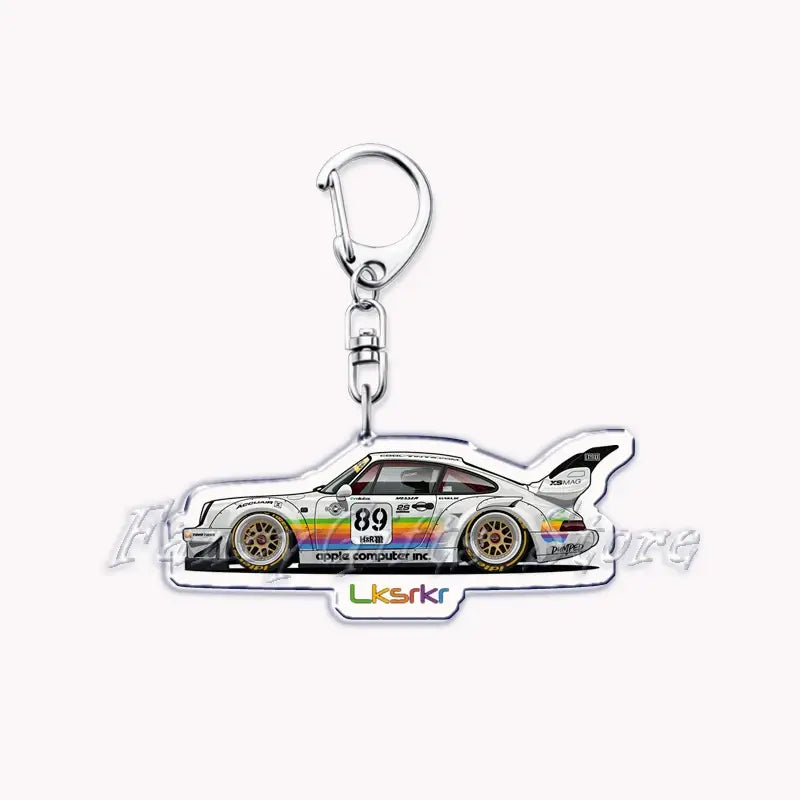 White acrylic Nissan Skyline keychain featuring a detailed anime-style race car illustration with rainbow stripes and the number 89.