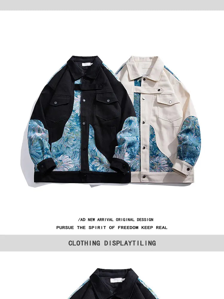 Bomberjacke im Streetwear-Stil aus Denim in Schwarz und Cremefarben mit floraler Stickerei; kräftige blaue florale Stickereien an Ärmeln, Brust und Schultern