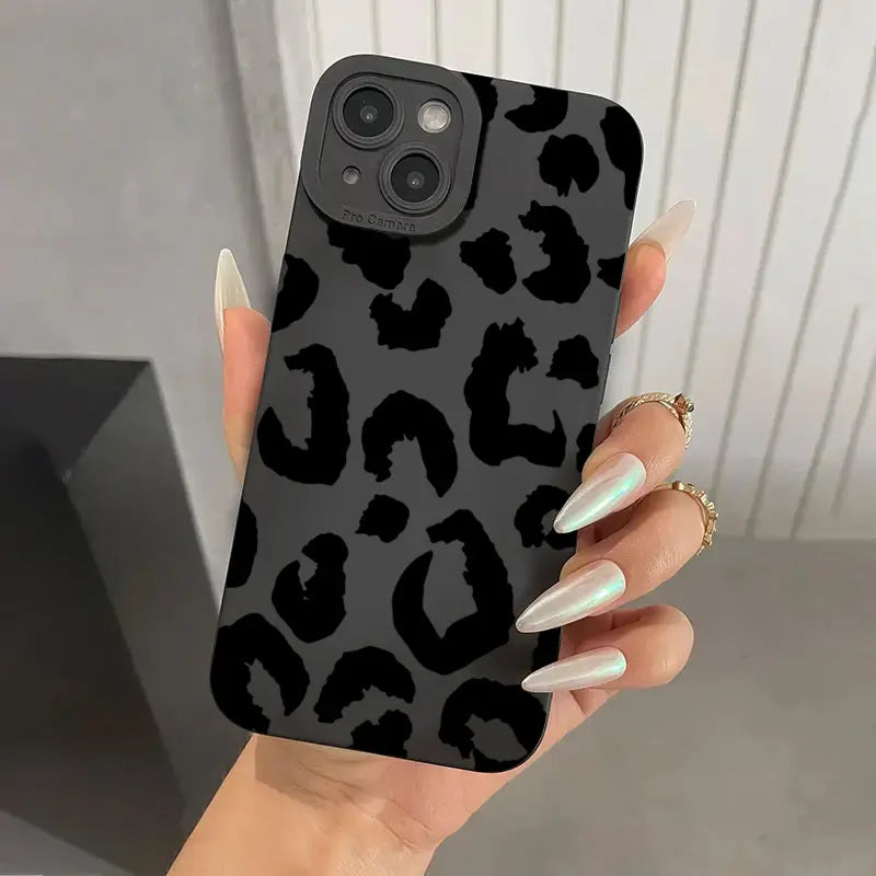 Black leopard-print matte black iphone case with a matte finish shown from the back side designed for camera protection.